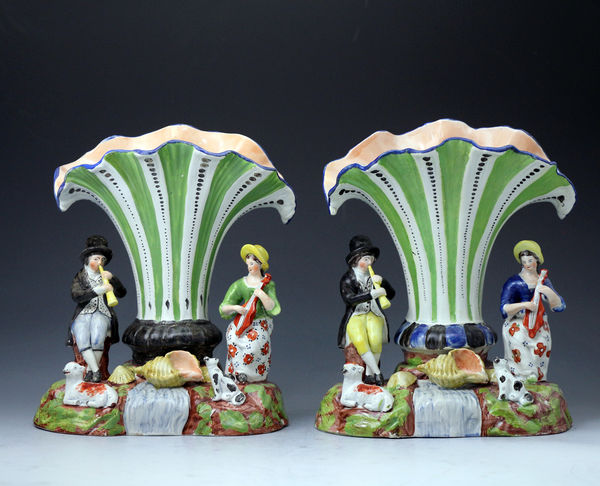 Antique Staffordshire pottery trumpet shape spill vases with figures of musician and animals.England early 19th century