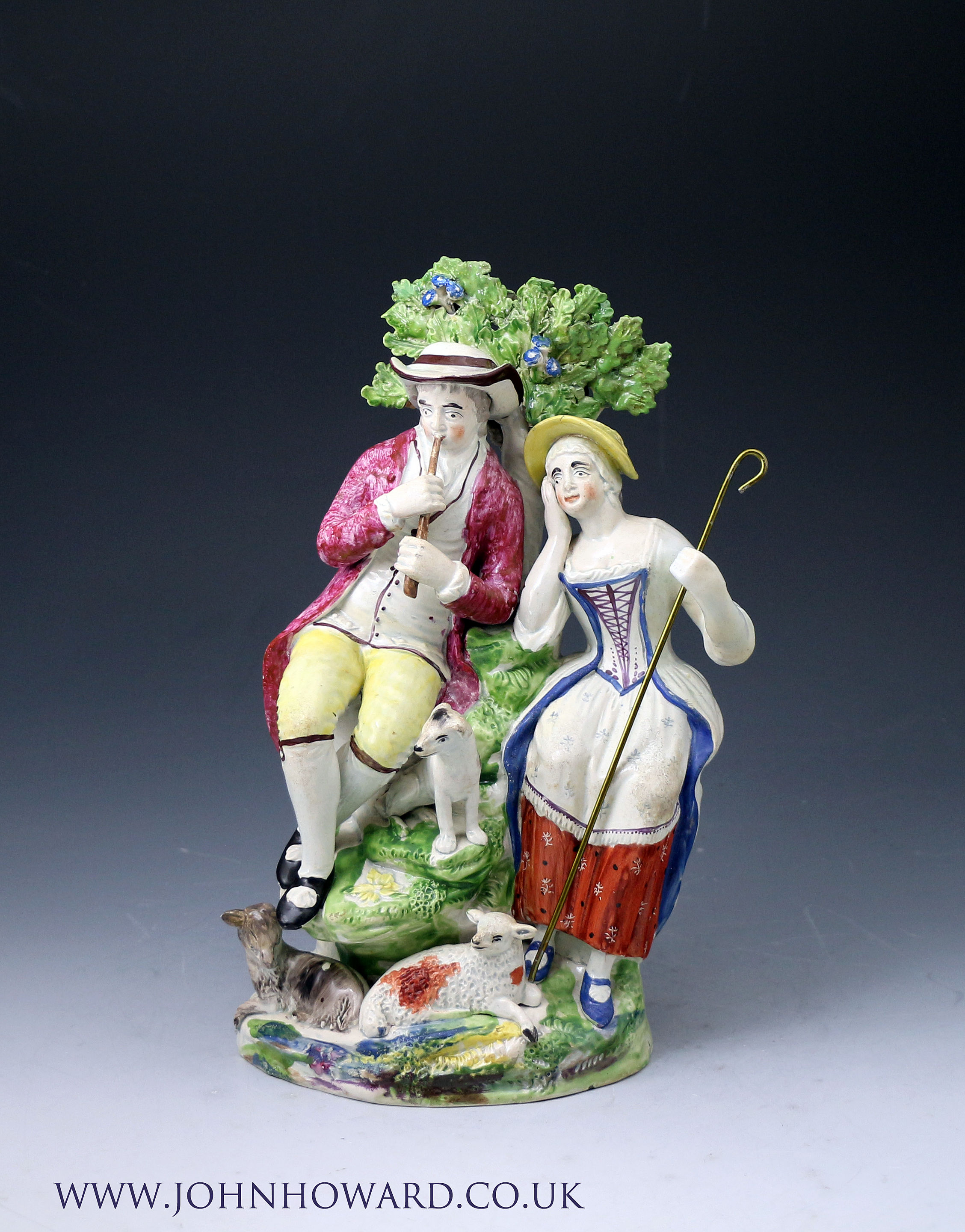 Staffordshire pottery figure group of a couple with their lamb, dog and goat late 18th century