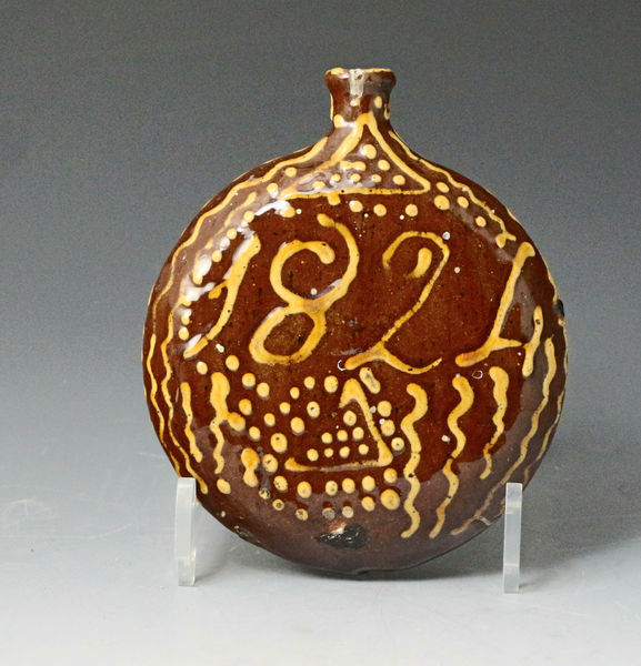 Slipware earthenware spirit Flask dated 1824 with the initials S H, Staffordshire England