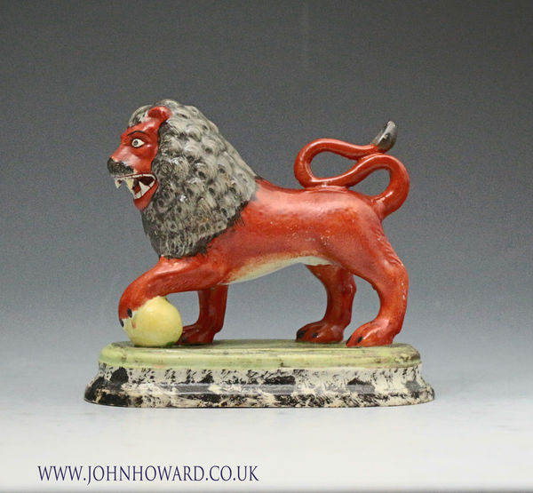 Antique Staffordshire pottery figure of a lion by Obadiah Sherratt, England circa 1820 