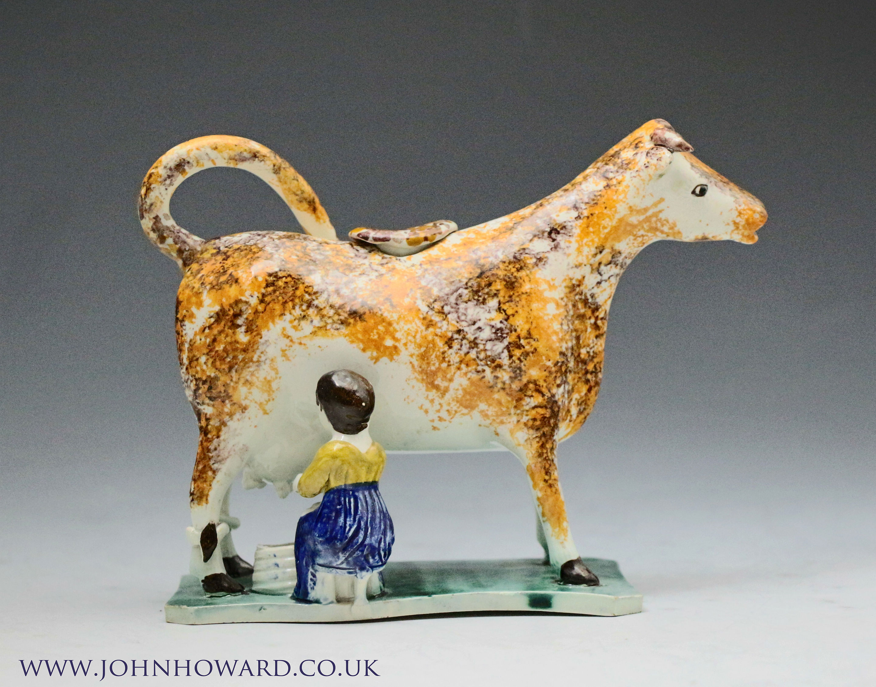 Antique English pottery figure Cow Creamer Yorkshire circa 1800 period.