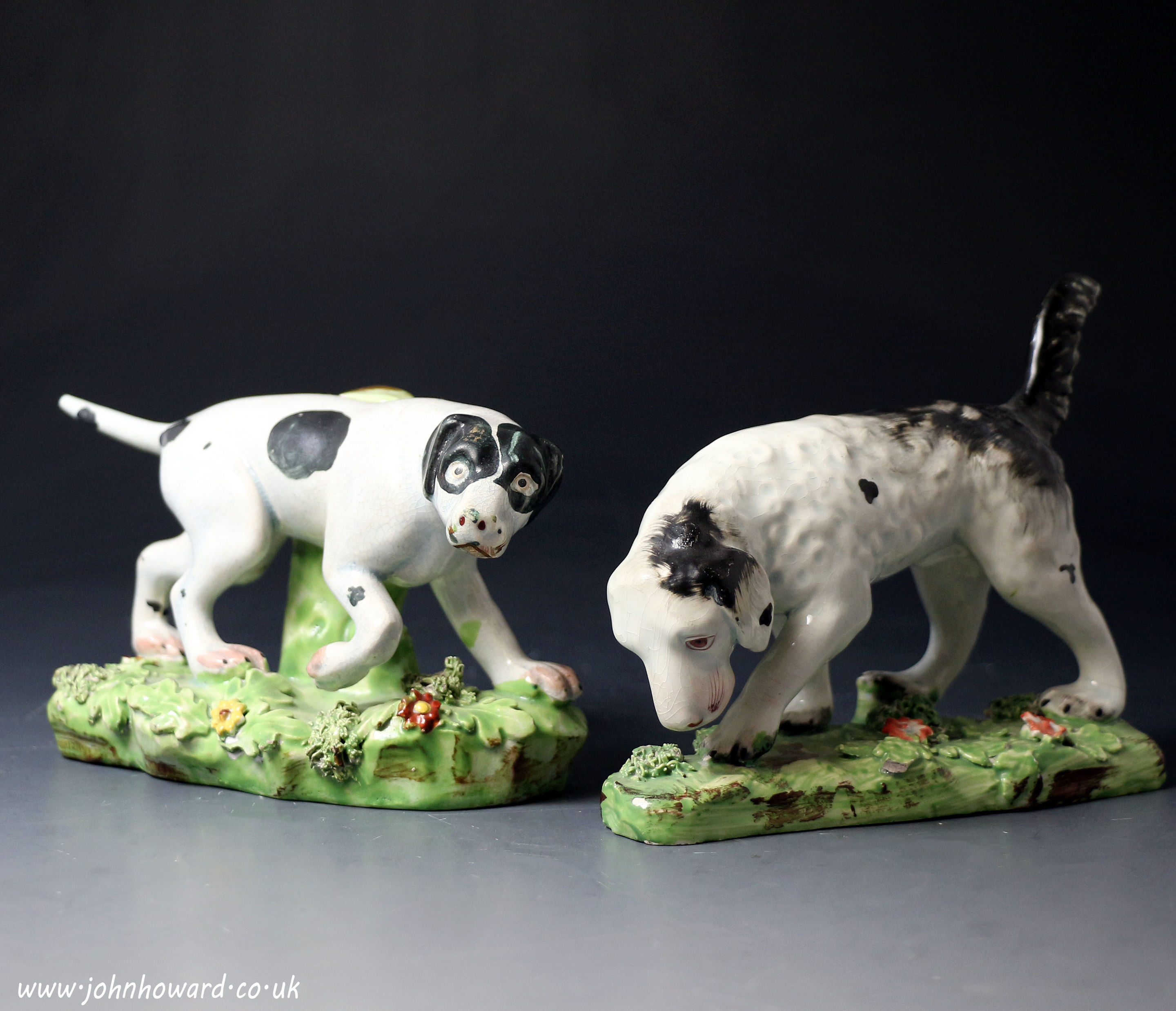 Antique Staffordshire pearlware pottery pair of figures of pointer and setter sporting dogs